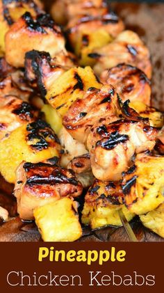 grilled pineapple chicken kebabs on a wooden board with text overlay