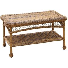 a wicker coffee table with two trays