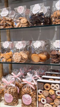 a display case filled with lots of donuts and cookies