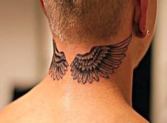 the back of a man's neck with wings on it