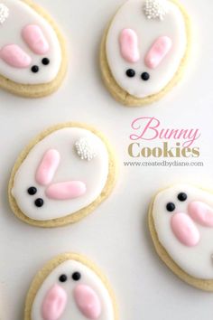 decorated cookies with pink and white frosting in the shape of bunnies