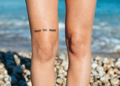 a woman's legs with words written on them