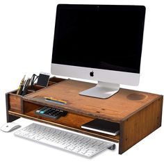 an apple computer sitting on top of a wooden desk next to a keyboard and mouse