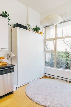 a white refrigerator freezer sitting inside of a kitchen