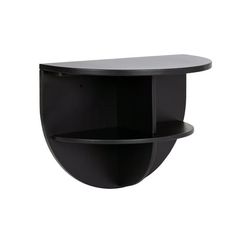 a black wall shelf with two shelves on each side and an oval shaped shelf above it