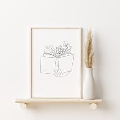 a drawing of a book with flowers in it sitting on a shelf next to a vase