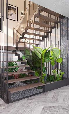 a stair case with plants and pictures on the wall