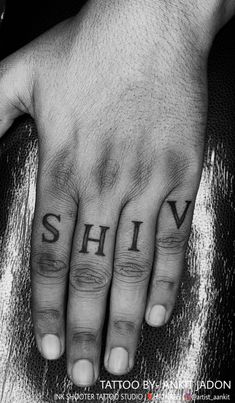 a hand with the word shiv tattooed on it