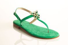 Introducing the Farfalla Verde Leather Sandals, a perfect blend of elegance and style. These stunning flat sandals are designed to make heads turn with their captivating green-tone. What truly sets them apart is the delicate butterfly ornamented with shimmering emerald stones, adding a touch of glamour to your ensemble. Crafted from premium Italian leather, these sandals offer both durability and comfort. The crystal embellishment adds a subtle sparkle, elevating their luxurious appeal. With a c Emerald Butterfly, Italian Leather Sandals, Butterfly Sandals, Sparkle Sandals, Butterfly Ornaments, Delicate Butterfly, Chic Flats, Sandals Flat, Leather Sandals Flat