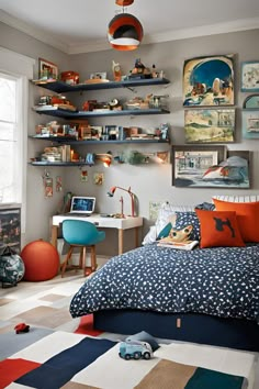 a child's bedroom decorated in blue, orange and white with lots of shelves