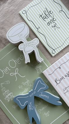 Image of modern wedding invitations with striped patterns, featuring hand-drawn fonts and a squiggly border. Additionally, there are hand-drawn champagne coupe glass place names and die-cut bow place cards with the wedding date. The design incorporates on-trend bows and hand-drawn illustrations in various shades of pink, green, and blue. This stationery set is ideal for a garden party English wedding and is created by papergrace.co.uk. Wedding Stationary Illustration, Champagne Coupe Illustration, Garden Party Place Cards, Die Cut Wedding Invitations, Bow Place Cards, Cute Greeting Card Ideas, Diecut Card, Tag Design Ideas, Wedding Cards Ideas