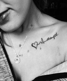 a woman with a tattoo on her chest that says, i love marriage and heart