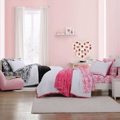 a bedroom with pink walls and white furniture