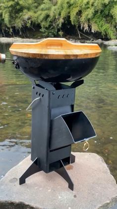 a boat sitting on top of a rock in the water