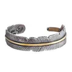 PRICES MAY VARY. NATIVE AMERICAN-INSPIRED DESIGN: This stainless steel cuff bracelet features a detailed feather motif, symbolizing trust, honor, strength, wisdom, power, and freedom in Native American culture. PREMIUM STAINLESS STEEL: Crafted from high-grade stainless steel for lasting durability, the bracelet is accentuated with a beautiful gold-tone band, creating an elegant two-tone effect. ADJUSTABLE AND COMFORTABLE FIT: The open cuff design allows for easy size adjustment to fit most wrist Feather Cuff Bracelet, Native American Feathers, Feather Bracelet, Meaningful Jewelry, Native American Culture, Bracelets And Charms, Cuff Bracelet, Fashion Watches, Bracelet Making