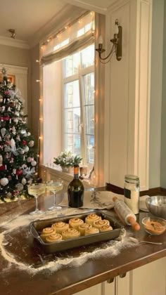 a christmas tree is decorated with lights and cookies