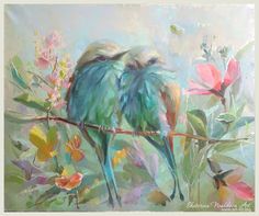 two birds sitting on a branch with flowers in the background