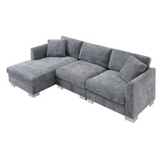 a large gray couch sitting on top of a white floor