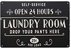 a sign that says laundry room drop your pants here and open 24 hours on it