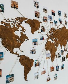 a world map is shown with many pictures on it's sides and pins in the middle