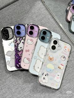 four cases with hello kitty on them sitting next to each other