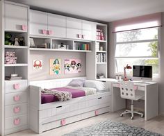 a child's bedroom with white furniture and pink accents on the walls, along with bookshelves