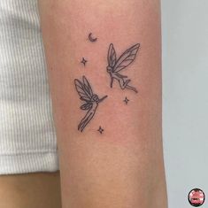 a couple of small tattoos on the arm