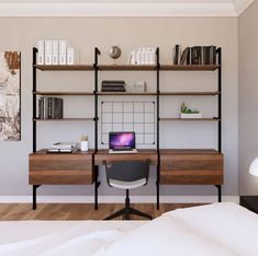 an image of a desk with bookshelves and a laptop on it in the room