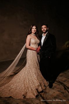 a bride and groom pose for a photo in their wedding dress at the end of their night