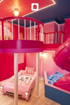 a bedroom with pink walls and a slide in the center, next to a child's bed