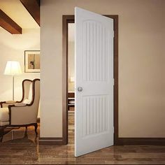 an open door leading to a living room with a chair and lamp on the side