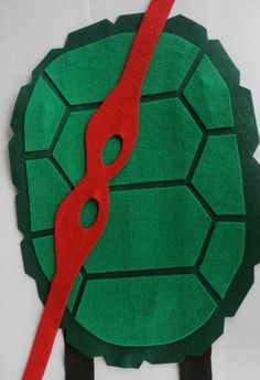 a paper cut out of a turtle with scissors