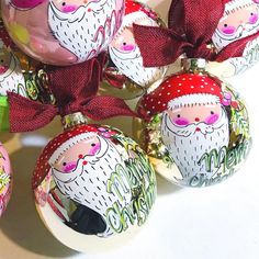 christmas ornaments with santa's faces on them