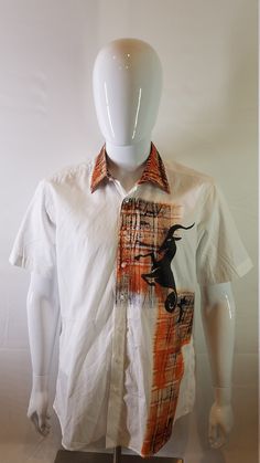 This Orange/White Painted Design shirt is from one of the finest collections of Edem Fashion Art in West Africa. The shirt comes in three different sizes M, L, XL  Edem Fashion Art is known for his talented clothes painting White Printed Shirt With Spread Collar, White Shirt With Graphic Print And Spread Collar, White Casual Short Sleeve Shirt, Cotton Tops With Graphic Print And Spread Collar, White Collared Printed T-shirt, White Printed Collared T-shirt, Fitted White Printed Shirt, Fitted White Short Sleeve Shirt For Spring, White Graphic Print Collar Top