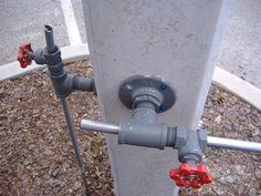 the pipes are connected to each other on the side of the street and in between two poles