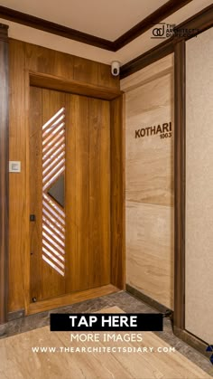 a wooden door with the kohari logo on it is in an empty room