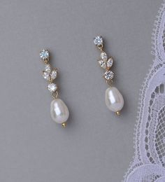 two pairs of pearl and crystal earrings