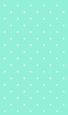 a green background with white polka dots