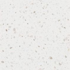 a white counter top with small speckles on it