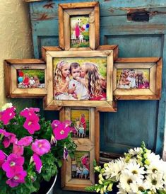 a group of pictures hanging on the side of a wall with flowers in front of it