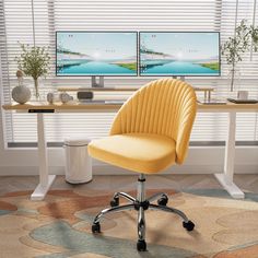 a yellow office chair sitting in front of a computer desk with two monitors on it