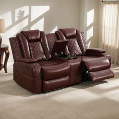 a living room with two recliners and a table in the middle of it