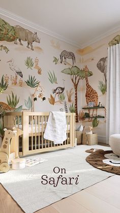 a baby's room with an animal theme on the wall, and a crib in the foreground