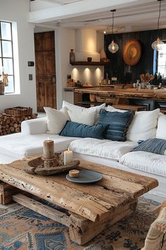 a living room filled with lots of furniture and decor on top of a wooden table