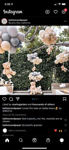 an instagram with balloons and teddy bears hanging from the tree in front of it