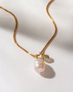 The organic shape of the pearl provides a unique focal point that is both modern and classic, making it a versatile addition to any jewelry collection. The necklace is 18 inches long and has a 3-inch extender, allowing you to adjust it to your desired fit. The combination of freshwater pearl and labradorite charm brings a sense of classic, timeless vibes to any outfit. Whether dressing up for a special occasion or adding a touch of charm to your daily attire, this necklace is the perfect choice Simple Sea Love Necklace Everyday, Ocean Necklace Simple, Cheap Minimalist Summer Jewelry, Pearl Pendant Necklace With Adjustable Chain, Adjustable Baroque Pearl Pendant Jewelry, Adjustable Baroque Pearl Jewelry With Pearl Pendant, Adjustable Pearl Pendant Necklace, Adjustable Pearl Drop Necklace Gift, Adjustable Baroque Pearl Necklace Gift