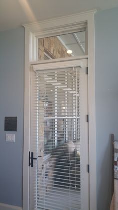 an open door with blinds on it