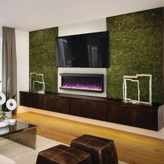 a living room with a fireplace and television mounted on the wall next to a window