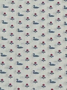 a white fabric with red flowers and ducks on it