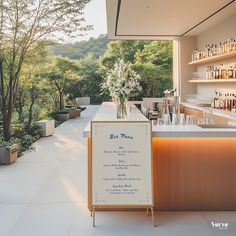 an outdoor bar with a menu on the counter